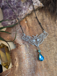 Moth Silvertone Necklace - Blue Drop